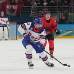 Feb 22, 2026; Milan, Italy; Dylan Larkin (21) of the United States in action against Canada in the men's ice hockey gold medal game during the Milano Cortina 2026 Olympic Winter Games at Milano Santagiulia Ice Hockey Arena.
