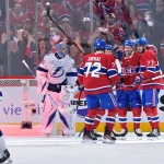 Apr 24, 2026; Montreal, Quebec, CAN; Montreal Canadiens forward Kirby Dach (77) celebrates with teammates after scoring a goal against Tampa Bay Lightning goalie Andrei Vasilevskiy (88) during the second period in game three of the first round of the 2026 Stanley Cup Playoffs at the Bell Centre.