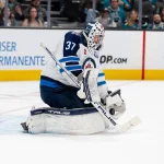 Feb 28, 2026; San Jose, California, USA; Winnipeg Jets goaltender Connor Hellebuyck (37) makes a save against the San Jose Sharks during the second period at SAP Center at San Jose.
