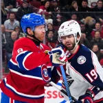 Apr 11, 2026; Montreal, Quebec, CAN; Montreal Canadiens defenseman Mike Matheson (8) punches Columbus Blue Jackets forward Adam Fantilli (19) during the third period at the Bell Centre.