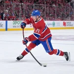 May 12, 2026; Montreal, Quebec, CAN; Montreal Canadiens defenseman Kaiden Guhle (21) takes a shot on net during the third period in game four against the Buffalo Sabres of the second round of the 2026 Stanley Cup Playoffs at Bell Centre.