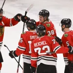 Mar 3, 2025; Chicago, Illinois, USA; Chicago Blackhawks defenseman Ethan Del Mastro (38), center, celebrates his goal against the Los Angeles Kings with teammates during the second period at the United Center.