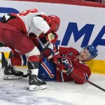 May 27, 2026; Montreal, Quebec, CAN; Carolina Hurricanes left wing William Carrier (28) checks Montreal Canadiens defenseman Kaiden Guhle (21) during the third period in game four of the Eastern Conference Final of the 2026 Stanley Cup Playoffs at Bell Centre.