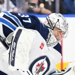 Dec 23, 2024; Toronto, Ontario, CAN; Winnipeg Jets goalie Connor Hellebuyck (37) makes a save against the Toronto Maple Leafs in the third period at Scotiabank Arena.
