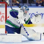 Jan 6, 2026; Buffalo, New York, USA; Vancouver Canucks goaltender Thatcher Demko (35) makes a blocker save during the second period against the Buffalo Sabres at KeyBank Center.