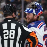 Jan 31, 2026; Pittsburgh, Pennsylvania, USA; New York Rangers goaltender Jonathan Quick (32) talks with referee Chris Lee (28) against the Pittsburgh Penguins during the third period at PPG Paints Arena.