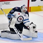 Apr 2, 2026; Dallas, Texas, USA; Winnipeg Jets goaltender Connor Hellebuyck (37) makes a glove save on a Dallas Stars shot during the first period at the American Airlines Center.