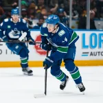 Apr 14, 2026; Vancouver, British Columbia, CAN; Vancouver Canucks defenseman Zeev Buium (24) handles the puck against the Los Angeles Kings in the second period at Rogers Arena.