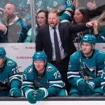 Jan 10, 2026; San Jose, California, USA; San Jose Sharks head coach Ryan Warsofsky instructs his team as left wing William Eklund (72) looks on with center Tyler Toffoli (73), defender Vincent Iorio (22) and defender Timothy Liljegren (37) against the Dallas Stars during the overtime period at SAP Center at San Jose.