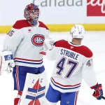 Feb 4, 2026; Winnipeg, Manitoba, CAN; Montreal Canadiens goaltender Samuel Montembeault (35) and defenseman Jayden Struble (47) celebrate a victory against the Winnipeg Jets at Canada Life Centre.