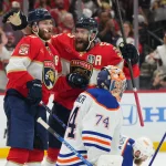 Jun 18, 2024; Sunrise, Florida, USA; Florida Panthers forward Matthew Tkachuk (19) celebrates scoring against Edmonton Oilers goaltender Skinner Stuart (74) with Florida Panthers defenseman Aaron Ekblad (5) during the second period in game five of the 2024 Stanley Cup Final at Amerant Bank Arena.