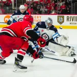 Mar 2, 2024; Raleigh, North Carolina, USA; Winnipeg Jets goaltender Connor Hellebuyck (37) stops the scoring chance by Carolina Hurricanes left wing Teuvo Teravainen (86) during the third period at PNC Arena.
