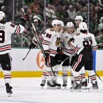 Mar 8, 2026; Dallas, Texas, USA; Chicago Blackhawks center Ryan Donato (8) and center Connor Bedard (98) and defenseman Sam Rinzel (6) and center Teuvo Teravainen (86) and left wing Tyler Bertuzzi (59) and center Frank Nazar (91) celebrate a goal during the game between the Stars and the Blackhawks at American Airlines Center.