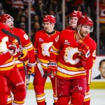 Apr 14, 2026; Calgary, Alberta, CAN; Calgary Flames left wing Blake Coleman (20) celebrates his goal with teammates against the Colorado Avalanche during the second period at Scotiabank Saddledome.