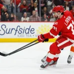Mar 28, 2026; Detroit, Michigan, USA; Detroit Red Wings center Dylan Larkin (71) skates with the puck in the second period against the Philadelphia Flyers at Little Caesars Arena.