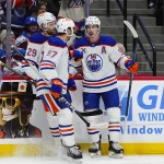 Mar 10, 2026; Denver, Colorado, USA; Edmonton Oilers center Ryan Nugent-Hopkins (93) celebrates his first period goal with center Leon Draisaitl (29) and center Connor McDavid (97) against the Colorado Avalanche at Ball Arena.