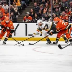 May 10, 2026; Anaheim, California, USA; Anaheim Ducks center Tim Washe (42) and Vegas Golden Knights center Nic Dowd (26) contend for the puck during the third period in game four of the second round of the 2026 Stanley Cup Playoffs at Honda Center.