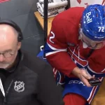 Arber Xhekaj regarde le combat de son frère au banc des pénalités
