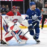 Sep 19, 2026; Toronto, Ontario, CAN; Toronto Maple Leafs forward Jack Roslovic (96) skates in front of Montreal Canadiens goalie Sam Montembeault (35) in the first period at Scotiabank Arena.