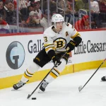 Mar 21, 2026; Detroit, Michigan, USA; Boston Bruins defenseman Charlie McAvoy (73) handles the puck during the third period against the Detroit Red Wings at Little Caesars Arena.