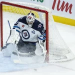 Jan 3, 2026; Ottawa, Ontario, CAN; Winnipeg Jets goalie Connor Hellebuyck (37) makes a save in the third period against the Ottawa Senators at the Canadian Tire Centre.