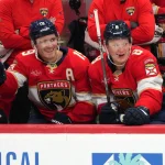 Sep 20, 2026; Sunrise, Florida, USA; Florida Panthers left wing Matthew Tkachuk (19) and his brother, left wing Brady Tkachuk (8), sit on the bench during the third period against the Carolina Hurricanes at Amerant Bank Arena.