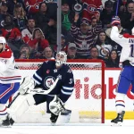 Feb 4, 2026; Winnipeg, Manitoba, CAN; Montreal Canadiens right wing Josh Anderson (17) celebrates a goal against Winnipeg Jets goaltender Connor Hellebuyck (37) in the second period at Canada Life Centre.
