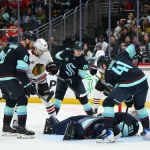 Apr 4, 2026; Seattle, Washington, USA; Seattle Kraken goaltender Philipp Grubauer (31) trapps the puck during the third period against the Chicago Blackhawks at Climate Pledge Arena.