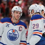 Nov 22, 2025; Sunrise, Florida, USA; Edmonton Oilers center Connor McDavid (97) speaks to center Leon Draisaitl (29) against the Florida Panthers during the second period at Amerant Bank Arena.