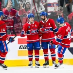 Sep 19, 2026; Montreal, Quebec, CAN; Montreal Canadiens Cole Caufield right wing (13) celebrates with defenseman Alexandre Carrier (45) and defenseman Lane Hutson (48) afterccc his game winning goal in overtime against the Toronto Maple Leafs at Bell Centre.