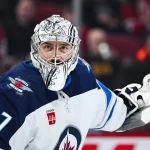 Jan 28, 2025; Montreal, Quebec, CAN; Winnipeg Jets goalie Connor Hellebuyck (37) tracks the play against the Montreal Canadiens during the second period at Bell Centre.