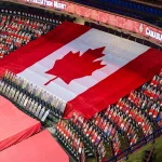 Mar 27, 2021; Calgary, Alberta, CAN; General view of cardboard cutouts of Canadian Armed Forces in front of the Canadian flag for the Canadian Armed Forces Appreciation Night prior to the game between the Calgary Flames and the Winnipeg Jets at Scotiabank Saddledome.