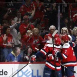 Apr 4, 2026; Washington, District of Columbia, USA; Washington Capitals right wing Ryan Leonard (9) celebrates with teammates after scoring a goal against the Buffalo Sabres during the third period at Capital One Arena.