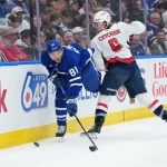 Apr 8, 2026; Toronto, Ontario, CAN; Toronto Maple Leafs center Dakota Joshua (81) battles with Washington Capitals defenseman Jakob Chychrun (6) during the first period at Scotiabank Arena.