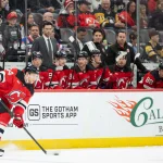 Apr 9, 2026; Newark, New Jersey, USA; New Jersey Devils defenseman Dennis Cholowski (44) skates with the puck during the first period against the Pittsburgh Penguins at Prudential Center.