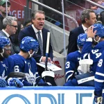 Sep 19, 2026; Toronto, Ontario, CAN; Toronto Maple Leafs head coach Jim Hiller speaks to his players during a time out against the Montreal Canadiens in the third period at Scotiabank Arena.