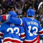 Apr 8, 2026; New York, New York, USA; New York Rangers defenseman Adam Fox (23) celebrates his goal with New York Rangers left wing Alexis Lafrenière (13) against the Buffalo Sabres during the second period at Madison Square Garden. :