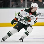 Apr 9, 2026; Dallas, Texas, USA; Minnesota Wild defenseman Quinn Hughes (43) skates against the Dallas Stars during the game between the Stars and the Wild at American Airlines Center: