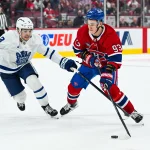 Sep 19, 2026; Montreal, Quebec, CAN; Montreal Canadiens Ivan Demidov right wing (93) plays the puck against Toronto Maple Leafs Nick Blankenburg defenseman (3) during overtime at Bell Centre.