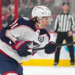 Apr 2, 2026; Raleigh, North Carolina, USA; Columbus Blue Jackets center Kent Johnson (91) takes a shot against the Carolina Hurricanes during the second period at Lenovo Center.: