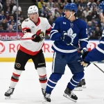Sep 23, 2026; Toronto, Ontario, CAN; Ottawa Senators defenseman Carter Yakemchuk (26) pushes Toronto Maple Leafs forward Matthew Knies (23) away from his goal area in the first period at Scotiabank Arena. :