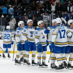 Apr 16, 2026; Salt Lake City, Utah, USA; The St. Louis Blues celebrate after defeating the Utah Mammoth at Delta Center.