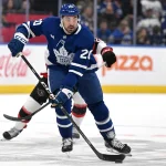 Sep 23, 2026; Toronto, Ontario, CAN; Toronto Maple Leafs forward Nick Paul (20) brings the puck up ice against the Ottawa Senators in the first period at Scotiabank Arena.