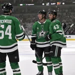 Sep 23, 2026; Dallas, Texas, USA; Dallas Stars forward Michael Sgarbossa (65) and right wing Matthew Seminoff (43) and forward Ellis Rickwood (54) celebrates a goal scored by Seminoff against the Minnesota Wild during the second period at the American Airlines Center.