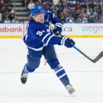 Dec 27, 2025; Toronto, Ontario, CAN; Toronto Maple Leafs defenseman Philippe Myers (51) shoots the puck against the Ottawa Senators during the third period at Scotiabank Arena.