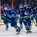 Apr 2, 2023; Vancouver, British Columbia, CAN; Vancouver Canucks forward Brock Boeser (6) and forward Phillip Di Giuseppe (34) and forward J.T. Miller (9) and defenseman Kyle Burroughs (44) celebrate Boeser's goal against the Los Angeles Kings in the first period at Rogers Arena.