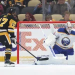 Sep 21, 2026; Pittsburgh, Pennsylvania, USA; against Buffalo Sabres goaltender Alex Lyon (34) defends the net against Pittsburgh Penguins right wing Bryan Rust (17) during the second period at PPG Paints Arena.