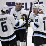 Mar 16, 2026; Dallas, Texas, USA; Utah Mammoth defenseman John Marino (6) and left wing Brandon Tanev (13) and left wing Michael Carcone (53) and center Alexander Kerfoot (15) celebrates a goal scored by Carcone against the Dallas Stars during the third period at the American Airlines Center.