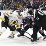 Apr 12, 2026; Columbus, Ohio, USA; Boston Bruins center Fraser Minten (93) and Columbus Blue Jackets center Adam Fantilli (19) face-off during the second period at Nationwide Arena.