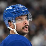 Sep 23, 2026; Toronto, Ontario, CAN; Toronto Maple Leafs forward Auston Matthews (34) speaks to a team mate before a faceoff against the Ottawa Senators in the second period at Scotiabank Arena.